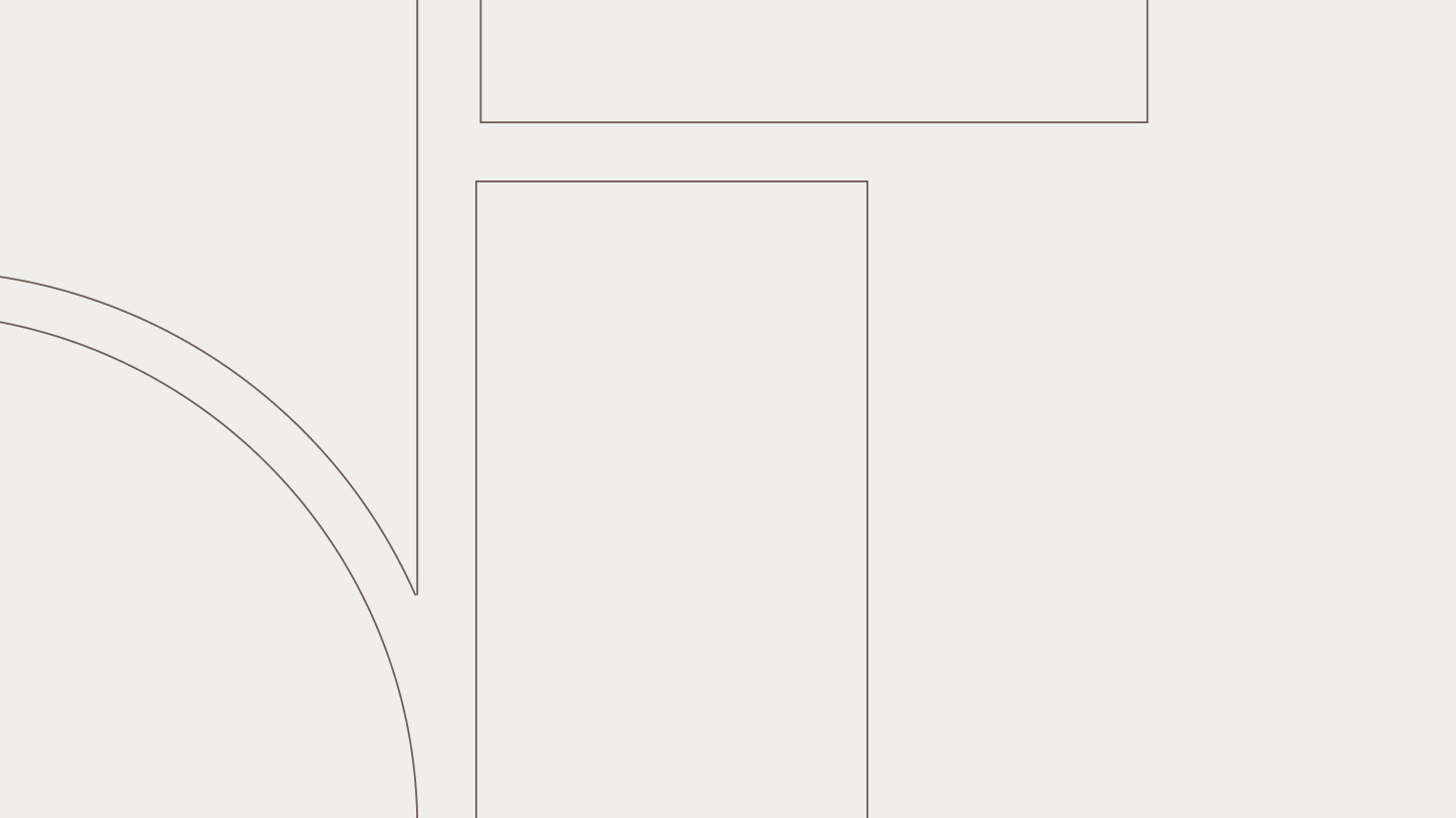 Minimalist map showing a circular area intersected by straight roads or boundaries on a pale background.